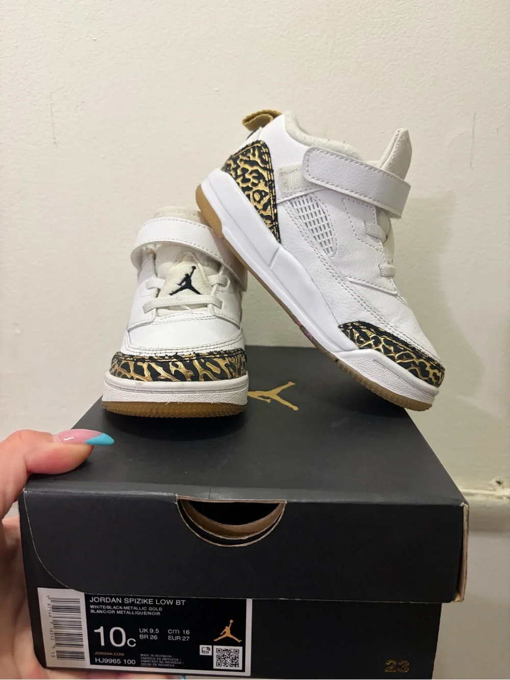 Jordan Kids White Sneakers with Black and Gold Accents